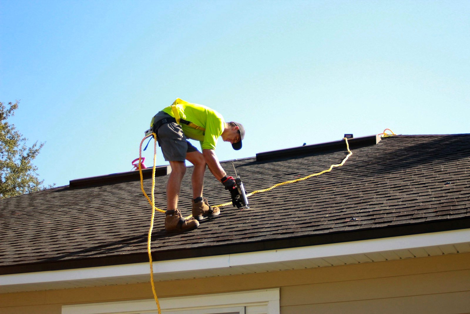 Installer working on a roof during a professional Starlink installation in Kigali